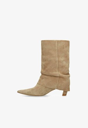 Tan suede mid-calf boot with pointed toe, slouchy shaft, and short angled heel, shown in side profile on white background.