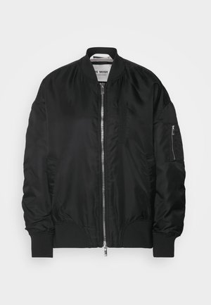 Black bomber jacket made of shiny, smooth fabric. Features a front zipper, ribbed cuffs, and multiple functional pockets. Simple design.