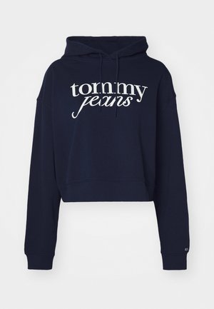 Navyblauwe cropped hoodie van katoen, met een witte "tommy jeans" logo, een trekkoordcapuchon en ribgebreide manchetten.