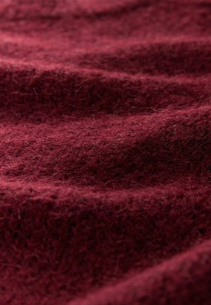 Burgundy wool fabric with a soft, textured surface, displaying a rippled pattern and fine fibers throughout. Rich, warm color.