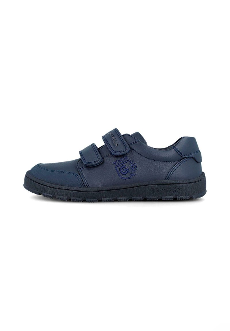 Zapatos de cuero navy con dos correas de Velcro. Presentan una suela texturizada y un logo bordado. Punta redondeada y collar acolchado para mayor comodidad.