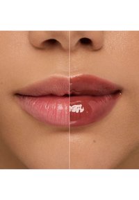 Two lips are shown side by side: left in a light pink shade, right in a deeper pink. Both have a glossy finish and smooth texture.