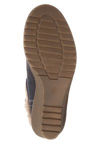 Semelle de chaussure avec une surface en caoutchouc marron texturé. Présente des motifs circulaires et linéaires, montrant une construction robuste et un marquage de taille 37.