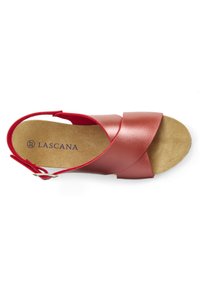 Red leather sandal with cross-over straps, ankle buckle, and a textured beige insole, featuring the brand name "LASCANA" in purple.