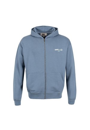Blaues Zip-Hoodie aus weichem Stoff mit einem gerippten Muster. Verfügt über eine Kapuze, Taschen auf der Vorderseite und ein kleinesbedrucktes Logo auf der Brust.