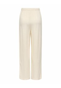 Pantalon large couleur crème avec taille élastique, texture lisse, présenté à plat sur un fond blanc.