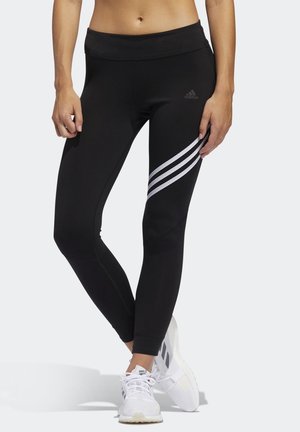 Leggings de sport noirs avec une taille haute, trois accents de bandes blanches sur le côté et une coupe ajustée. Fabriqués en matériau extensible.