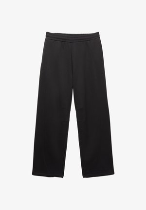 Zwarte wijde broek met een elastische tailleband en gestikte naden op de voorkant van de knieën.