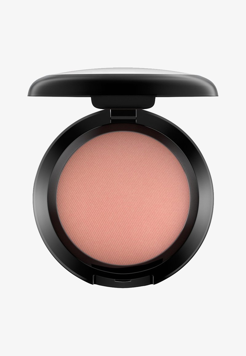 Ronde blush compact met een zwarte plastic buitenkant. Bevat een gladde, lichtroze poeder met een geribbeld patroon. Met scharnierende opening.
