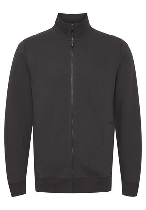 Hanorac cu fermoar de culoare gri închis, cu guler înalt, mâneci lungi și buzunare laterale. Fabricat dintr-un material neted și moale, cu un design simplu.