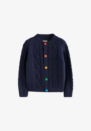 Cárdigan de punto azul marino con patrones texturizados de diamantes y botones coloridos en rojo, naranja, amarillo, verde y azul en la parte delantera.