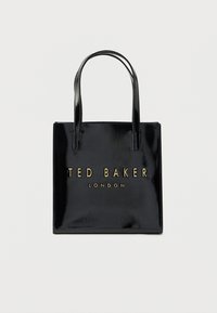 Fekete lakkbőr nagy fülű táska két fogantyúval és arany "TED BAKER LONDON" logóval az elején. Téglalap alakú és sima textúrájú.