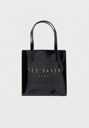 Sort skinnveske i skinn med to håndtak og gullfarget "TED BAKER LONDON"-logo foran. Rektangulær form og glatt tekstur.