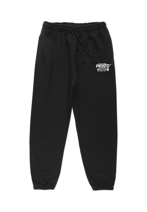 Czarne spodnie dresowe wykonane z miękkiego materiału, z elastycznym pasem w talii, sznurkiem do regulacji oraz małym logo na lewym udzie.