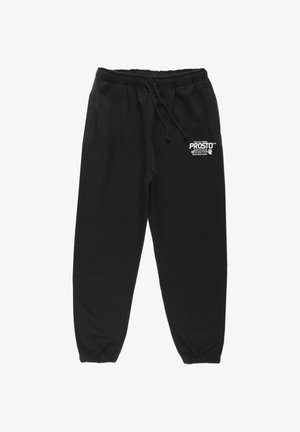 Czarne spodnie dresowe wykonane z miękkiego materiału, z elastycznym pasem w talii, sznurkiem do regulacji oraz małym logo na lewym udzie.