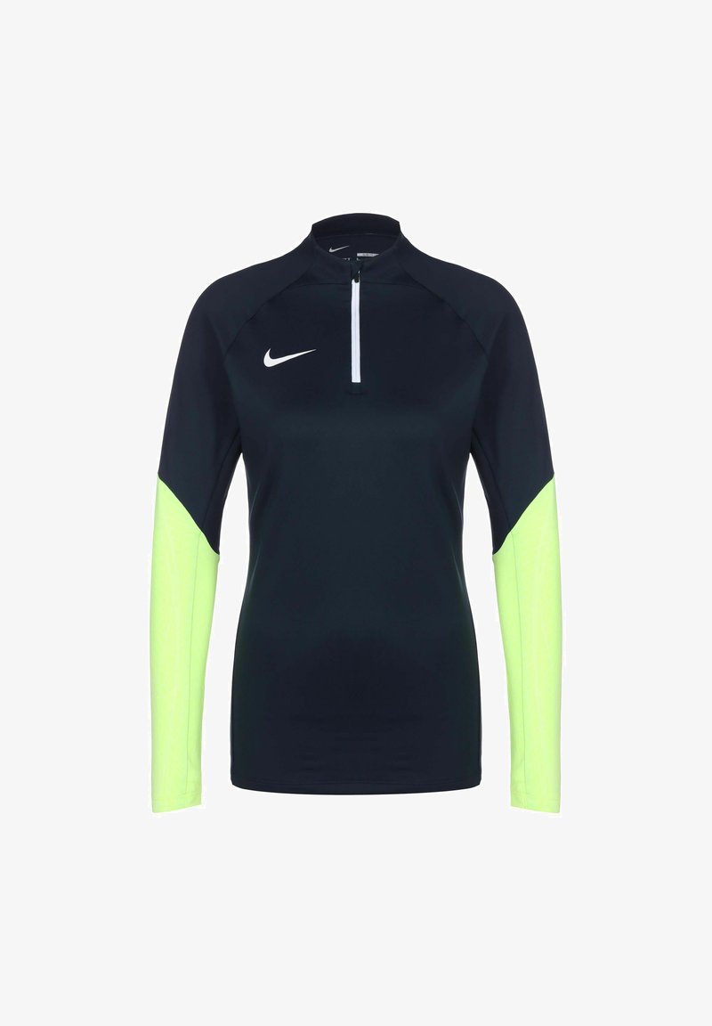 Haut de sport à manches longues en marine foncé avec des manches vert fluo. Présente un col haut et une fermeture éclair sur le devant sur un quart. Fabriqué en tissu léger et extensible.