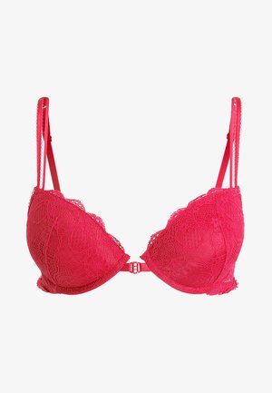 Roze kanten bh met golvende randen, onderdraadondersteuning, verstelbare bandjes en een haaksluiting aan de achterkant.