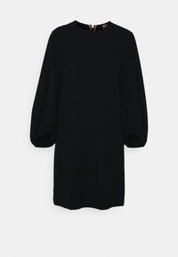 Robe noire avec un col rond, des manches bouffantes et une fermeture éclair dans le dos. Fabriquée en tissu doux, elle a une coupe décontractée.