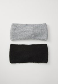 Two knitted headbands displayed horizontally: one light gray, the other black. Both have a textured, ribbed pattern and soft finish.