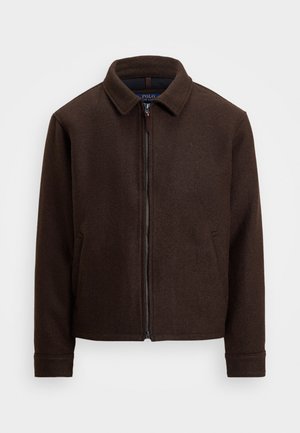 Veste zippée en laine marron foncé avec col et deux poches latérales, présentée sur un fond clair uni.