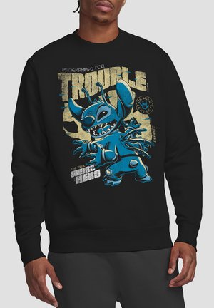 Black sweatshirt featuring a blue cartoon character with exaggerated features. Text on the front displays "Programmed for Trouble" in yellow.