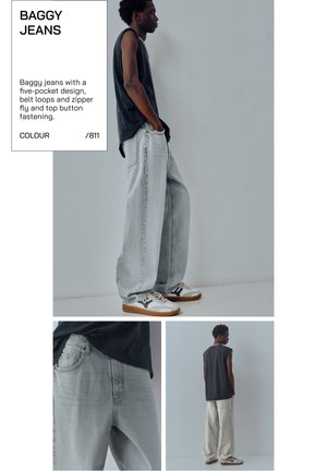 Model iført lysegrå, løstsiddende jeans med fem lommer, bæltestropper, lynlåsgylp og øverste knap, kombineret med sort ærmeløs top og sneakers.