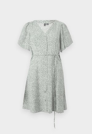 Short-sleeved, V-neck dress in light green fabric with white speckled pattern, featuring a button front and adjustable tie waist.