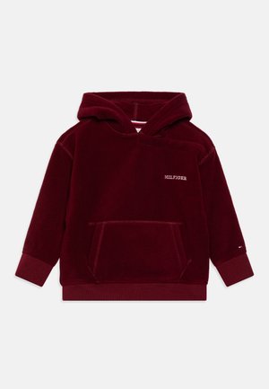 Sweat à capuche bordeaux en molleton doux avec une poche kangourou et des poignets côtelés. Logo "HILFIGER" brodé sur la poitrine.