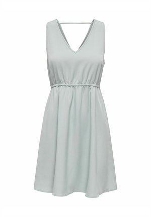 Lichtgroene mouwloze jurk met een V-hals, elastische taille en vloeiende rok. Zacht stof met een gladde textuur.