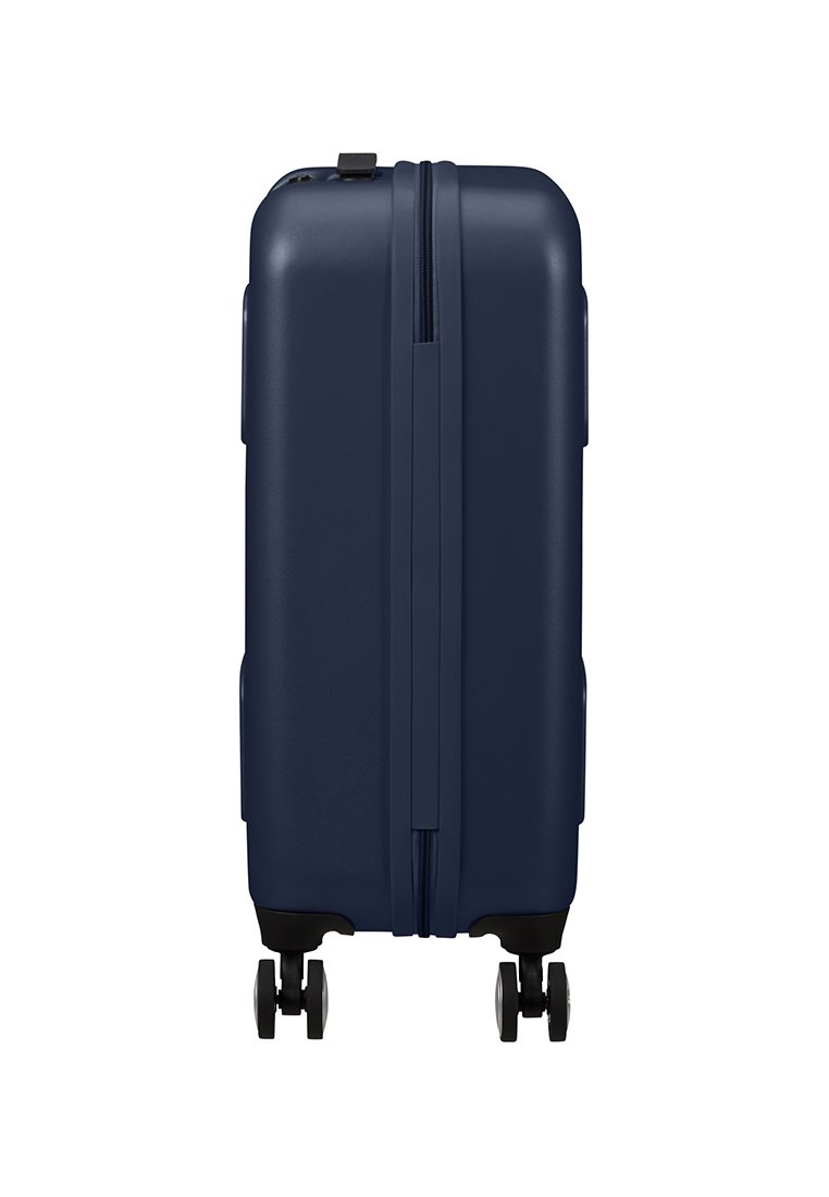 Valigia rigida blu navy con design elegante, chiusura con zip, superficie liscia e quattro ruote per una facile mobilità.