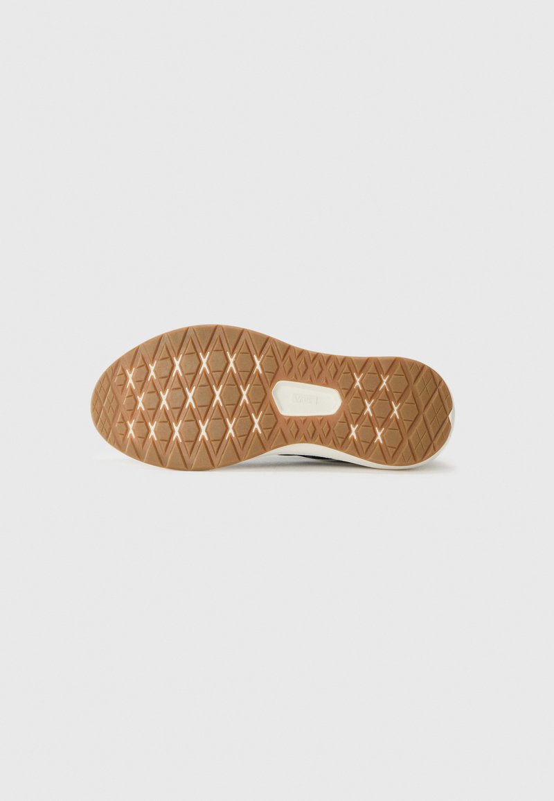 Suela de zapato de goma con un patrón texturizado en forma de diamante en tonos marrón claro y beige claro. El borde tiene un acabado suave.