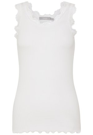 White sleeveless top in textured fabric, featuring lace trim along the neckline and armholes. Scalloped hem detail.