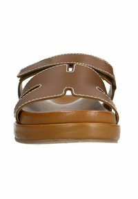 Brown leather sandal with two adjustable straps, featuring white stitching and a wide open toe. The sole is a contrasting light brown color.