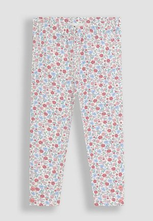 Lasten valkoiset legginssit, joissa on koko pinnan pieni punainen, vaaleanpunainen, sininen ja vihreä kukkakuosi sekä kaksi pientä nappia nilkoissa.