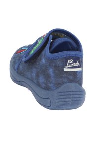Blauwe textiel schoen met klittenbandsluiting, gestructureerde bovenkant en rubberen zool. Kenmerkt kleurrijke borduursels aan de voorkant en een gemerkte hiel.