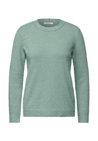 Mintgrön tröja med långa ärmar, rund hals, mjuk textur och en något lurvig finish. Etikett synlig vid halsringningen.