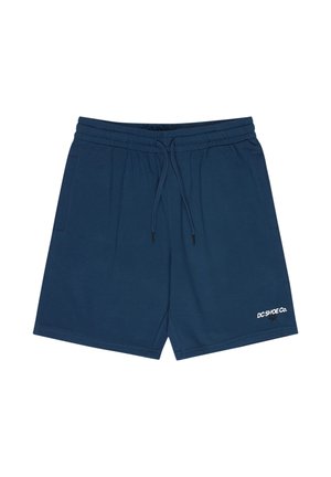 Modré bavlněné teplákové šortky s elastickým pasem, šňůrkou na stažení, bočními kapsami a bílým logem "DC SHOE Co." na spodní pravé straně.