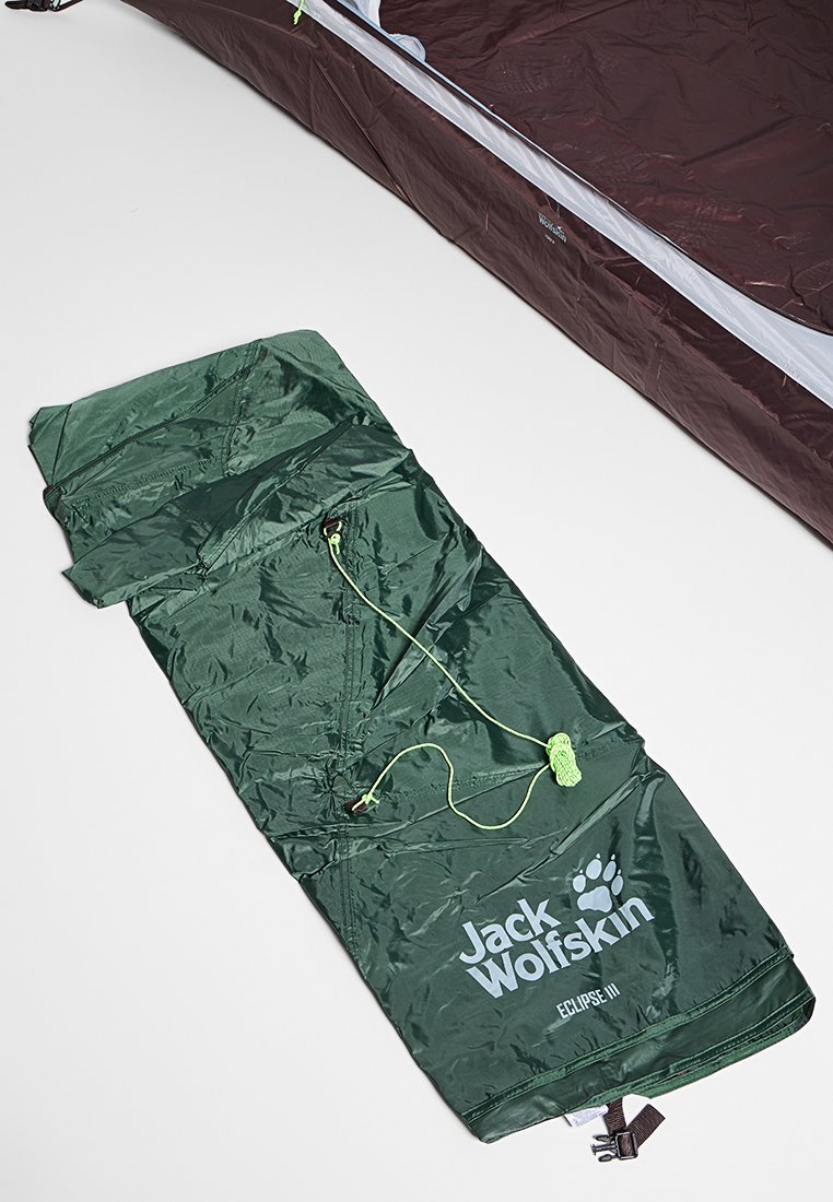 Zielony śpiwór Jack Wolfskin z zapięciem na zamek, podszyty wnętrzem, elastycznymi sznurkami i nadrukiem logo. Gładka tkanina i smukły design.