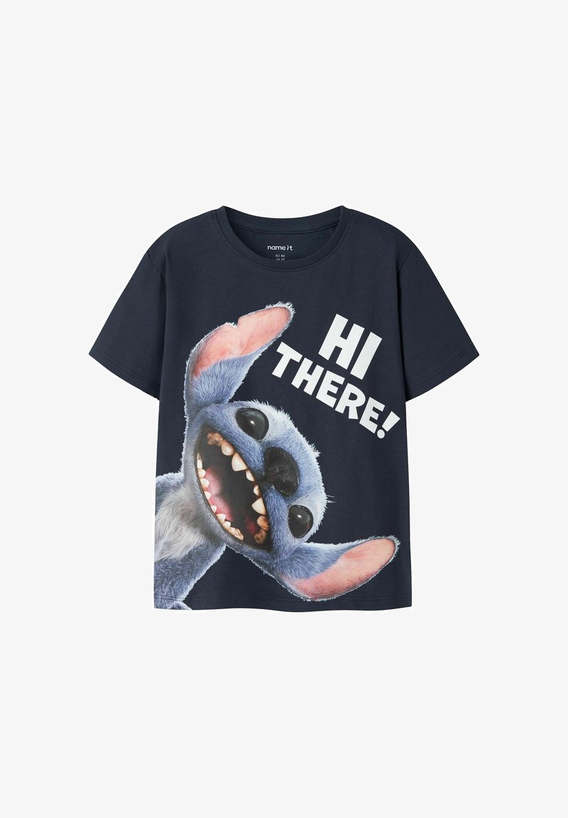 T-shirt bleu marine pour enfants avec un grand personnage de dessin animé souriant et un texte blanc disant "HI THERE!" sur le devant.