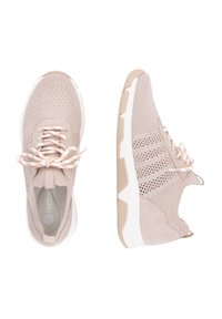 Beige athletic shoes with a mesh upper and suede accents. Features a white sole and textured detailing. Includes light-colored laces.