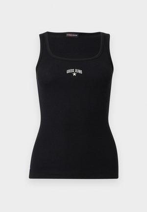 Musta ribattu toppi, jossa neliömäinen pääntie, "GUESS JEANS" -teksti ja tähti-logo rinnan keskellä.