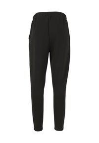 Zwarte joggingsbroek met elastische tailleband, gemaakt van zachte stof, met een taps toelopend ontwerp, zijzakken en een gladde textuur.