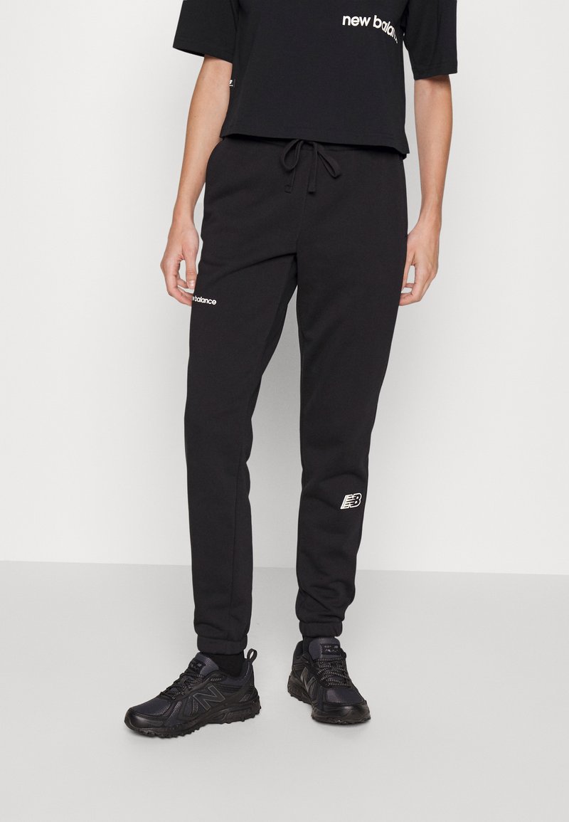 New Balance ESSENTIALS Tracksuit bottoms black/black Zalando