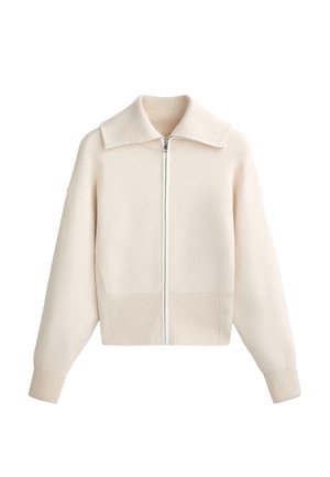 Beige gebreide ritsvest met ribbels aan de manchetten en onderrand, brede kraag en lange mouwen.
