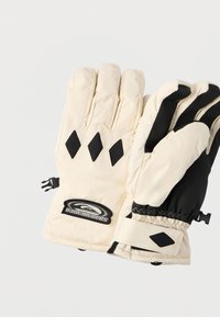 Gants isolants beige avec accents noirs, comportant trois doigts, motifs en diamant et une sangle de poignet réglable. Marquage sur le poignet.