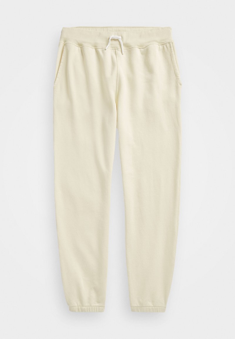 Kremafarbene Sweatpants aus weichem Stoff, mit einem elastischen Bund und Kordelzug, zwei Seitentaschen und schmal zulaufenden Bündchen.