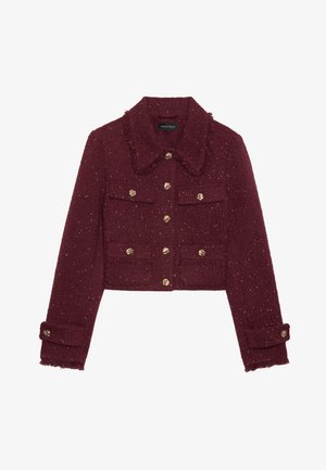 Chaqueta corta burdeos en tejido texturizado con motas doradas. Presenta un cuello puntiagudo, bolsillos frontales y botones decorativos dorados.