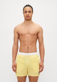 Tommy Hilfiger - HERITAGE MEDIUM DRAWSTRING - Swimming shorts - citronella Thumbnail Image 1