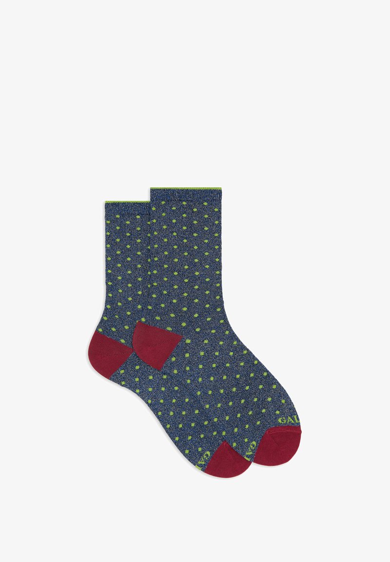 Calzini blu navy con pois verdi, dettagli rossi su tallone e punta. Realizzati in tessuto strutturato; design alla caviglia.