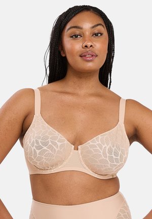 Soutien-gorge en lingerie beige avec motif de dentelle florale, bonnets moulés, bretelles réglables et subtile brillance. Bande lisse et finition sans couture.